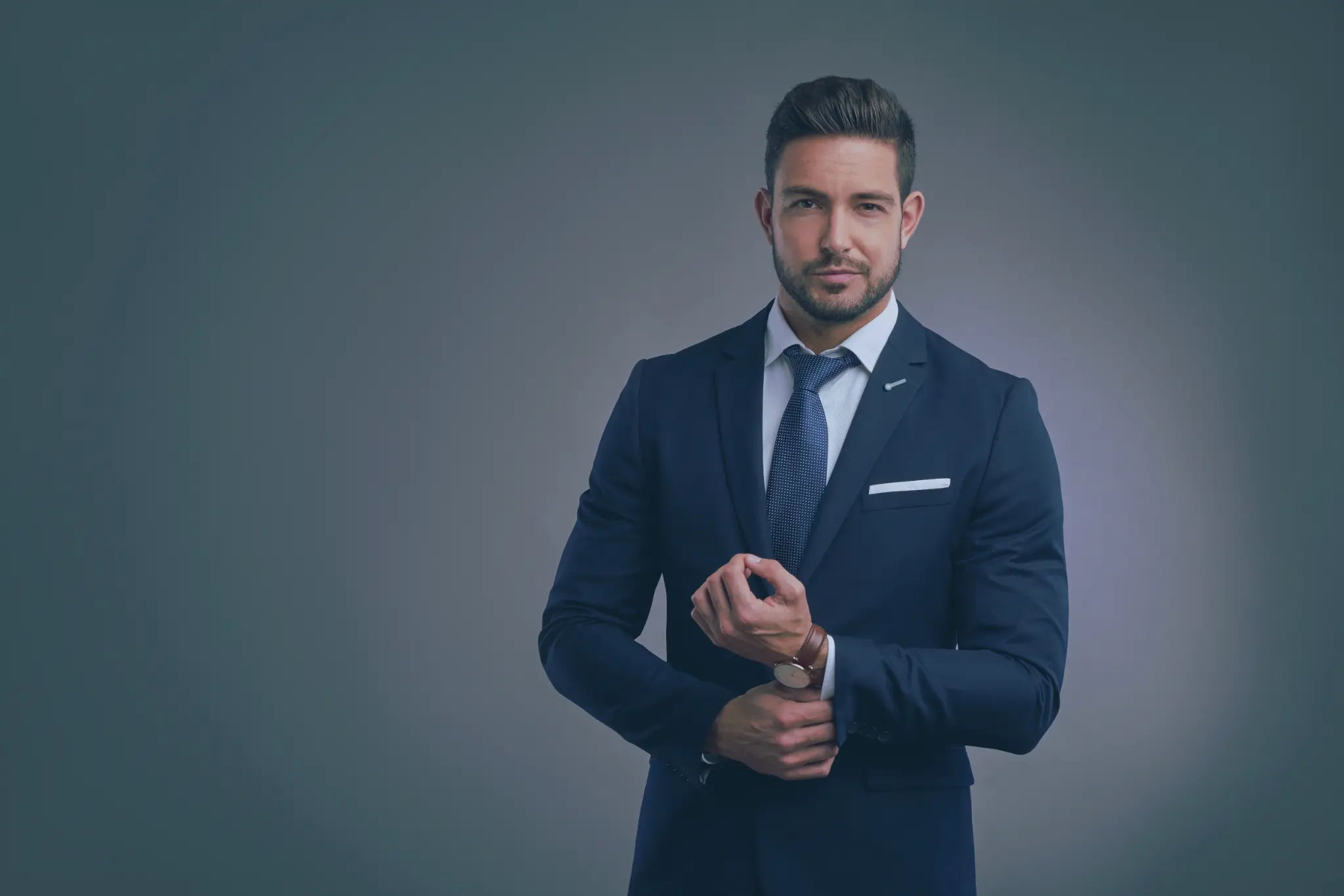 Man in a suit wearing a Jacket Pop lapel pin